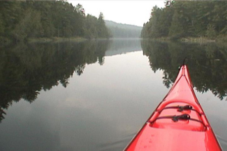 On the water.  A hazy grey sky with lots of humidity reflects the peacefulness of the area.