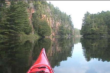 Another look downstream at the beginning 	(or the end) of the high rock walls.