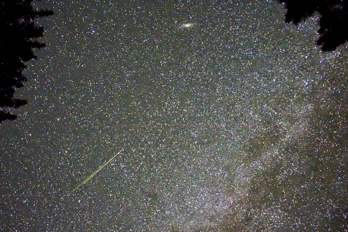 Aug. 15, 2021   Here a green meteor and white light reflected from a satellite are seen together.