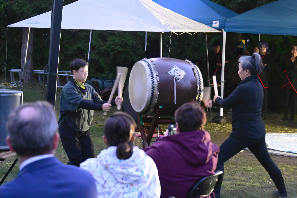 Wy-Joung Kou a member of the RC Inquest Community Art Response project, an Associate Artistic Director with ReDefine Arts) with a fellow member of RAW (Raging Asian Womxn) Taiko Drummers, of Toronto
